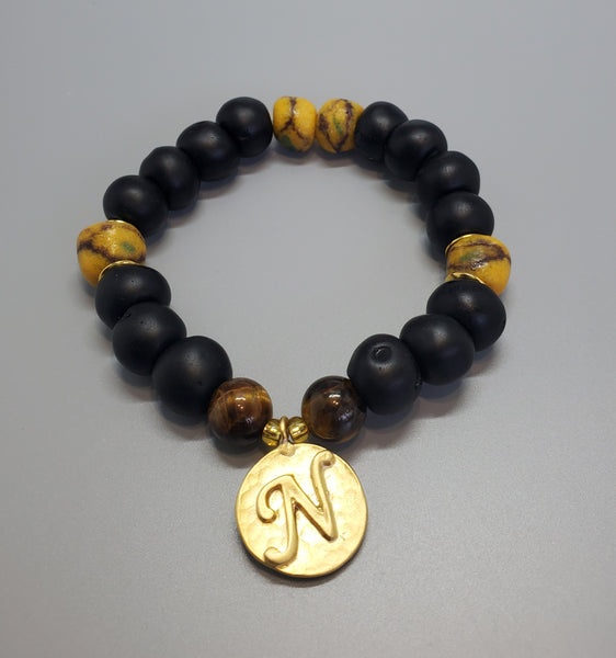 Black, Must. Krobo Beads, Tiger Eye, 22K Gold Plated Plated Brass "N" Charm, Brass, Unisex Stretch Bracelet