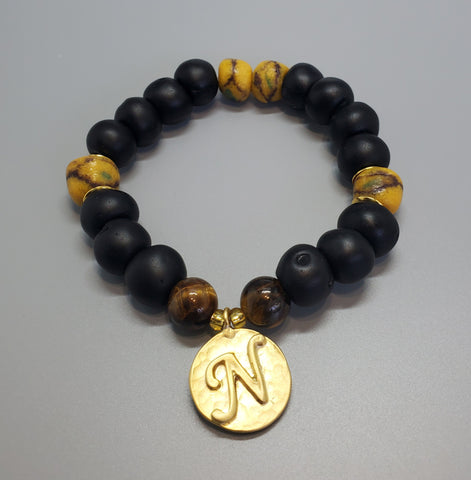 Black, Must. Krobo Beads, Tiger Eye, 22K Gold Plated Plated Brass "N" Charm, Brass, Unisex Stretch Bracelet