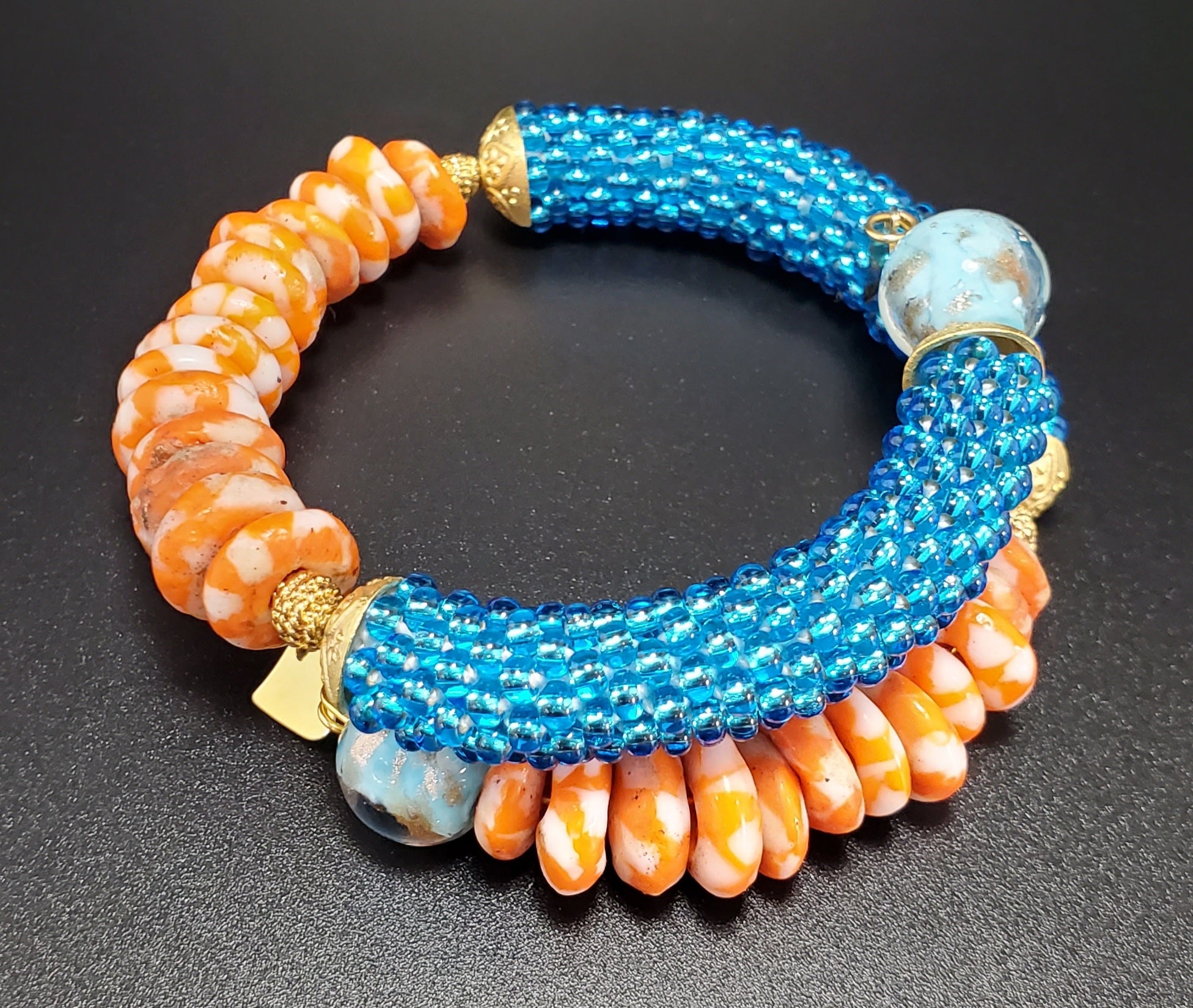 Orange/White Krobo Beads, Aqua Czech Seed Beads, Aqua Lampwork, Brass Beaded Crochet Bangle