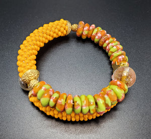 Green Orange Multi Krobo Beads, Light Orange Czech Seed Beads, Amber Lampwork, Brass Beaded Crochet Bangle