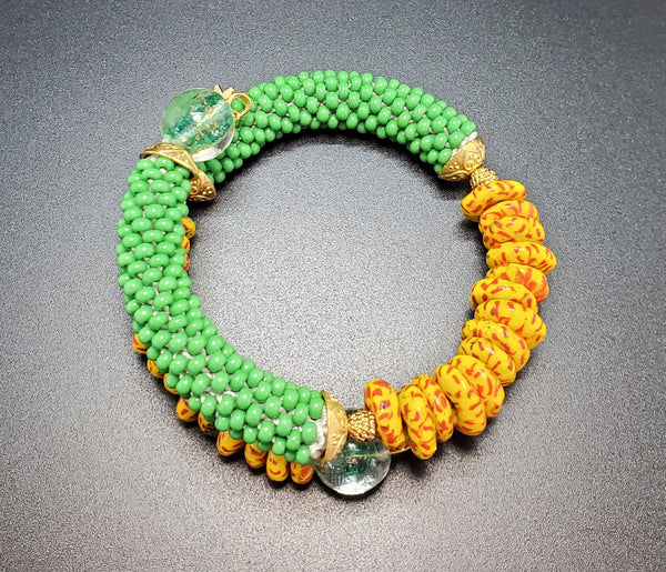 Orange Multi Krobo Beads, Green Czech Seed Beads, Green Lampwork, Brass Beaded Crochet Bangle