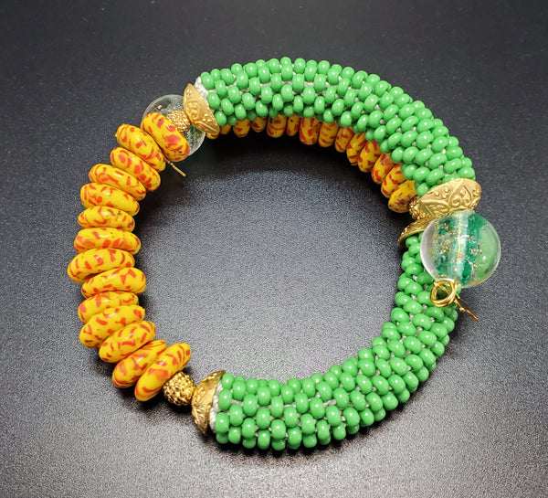 Orange Multi Krobo Beads, Green Czech Seed Beads, Green Lampwork, Brass Beaded Crochet Bangle