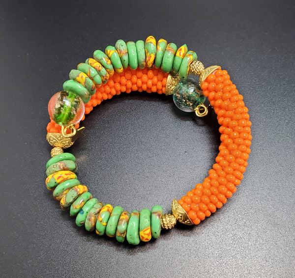 Green Multi Krobo Beads, Orange Czech Seed Beads, Green Lampwork, Brass Beaded Crochet Bangle