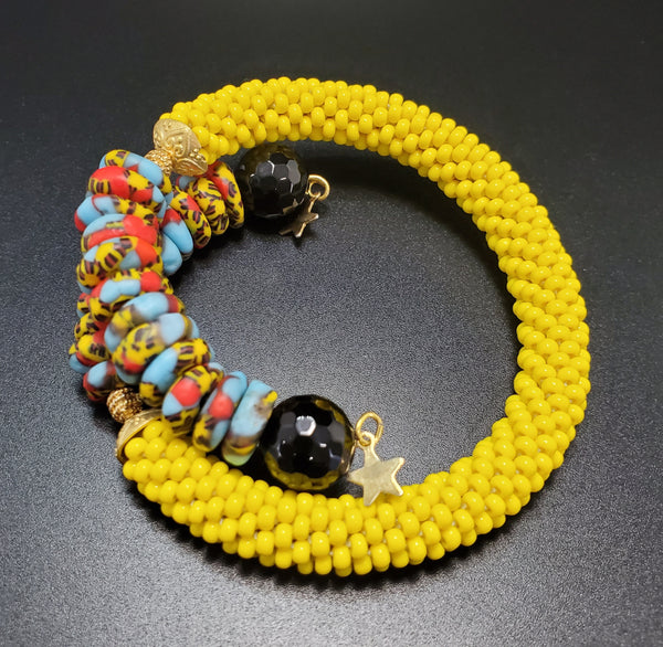 Blue Multi Krobo Beads,  Yellow Czech Seed Beads, Black Onyx Beads, Brass Beaded Crochet Bangle
