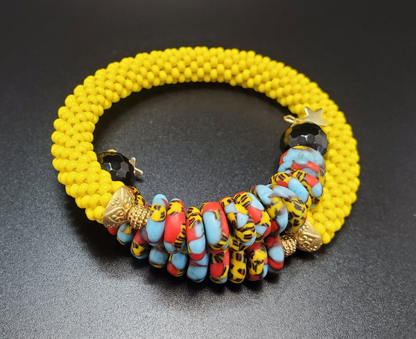 Blue Multi Krobo Beads,  Yellow Czech Seed Beads, Black Onyx Beads, Brass Beaded Crochet Bangle